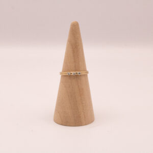 3 Cubic Zirconia bezel set on double band Gold-Fill stacking ring.
